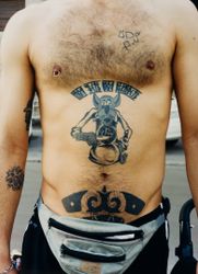 Tattoo says: My honor, My loyalty