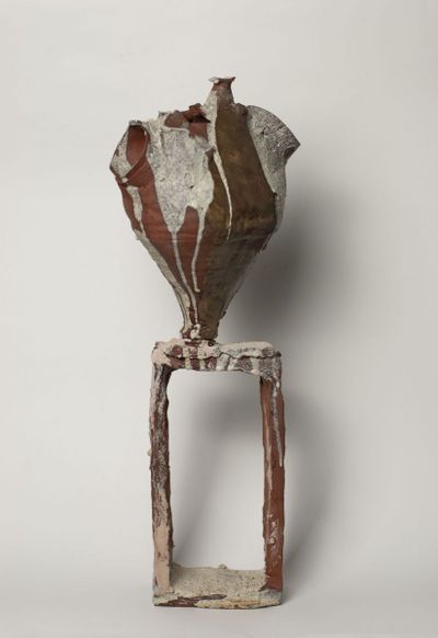 Dark sandy vase on the stage